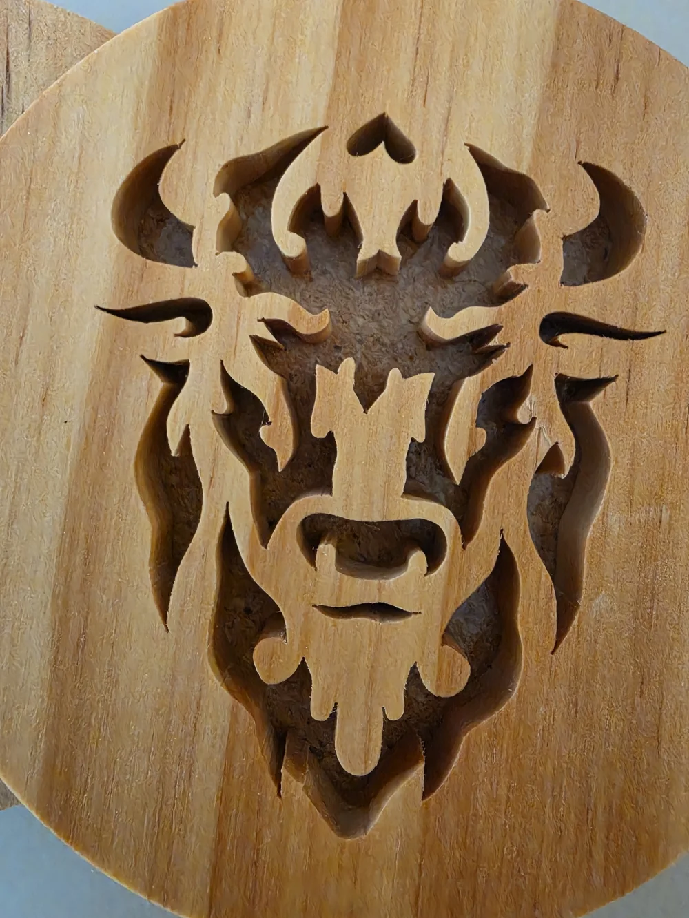 Four Wooden drink coaster set Intricate, stylized bison/buffalo head silhouette